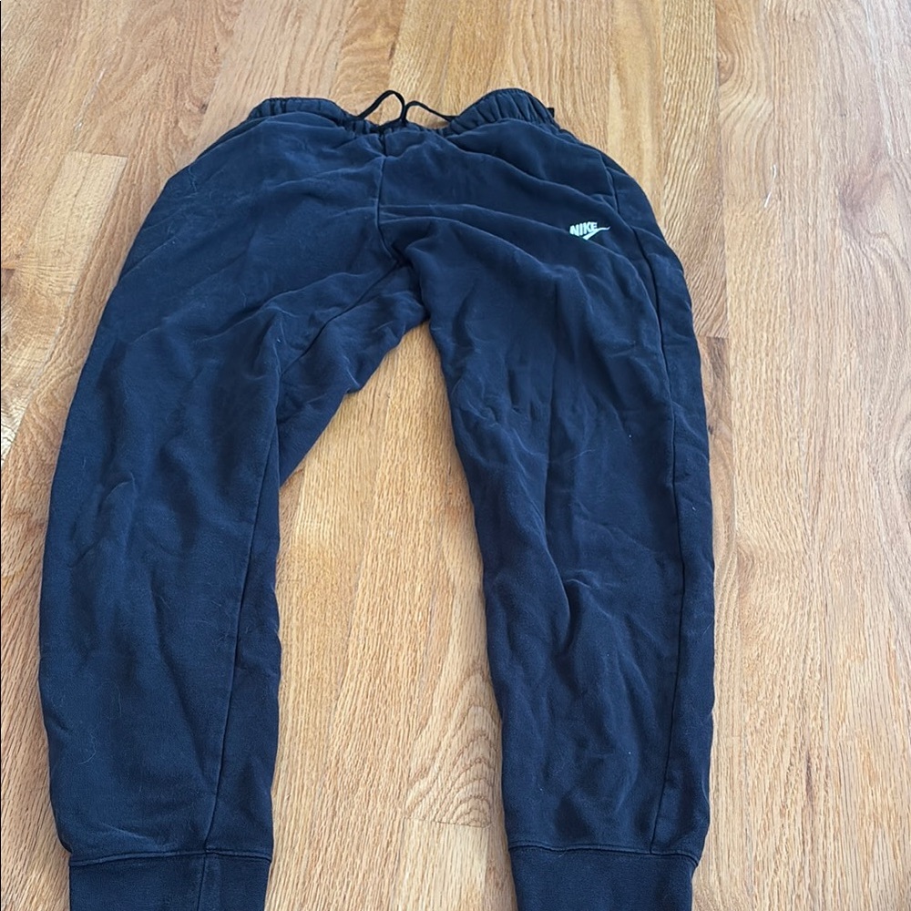 Nike Black Sweatpants with Tapered Legs and Elastic Waistband
